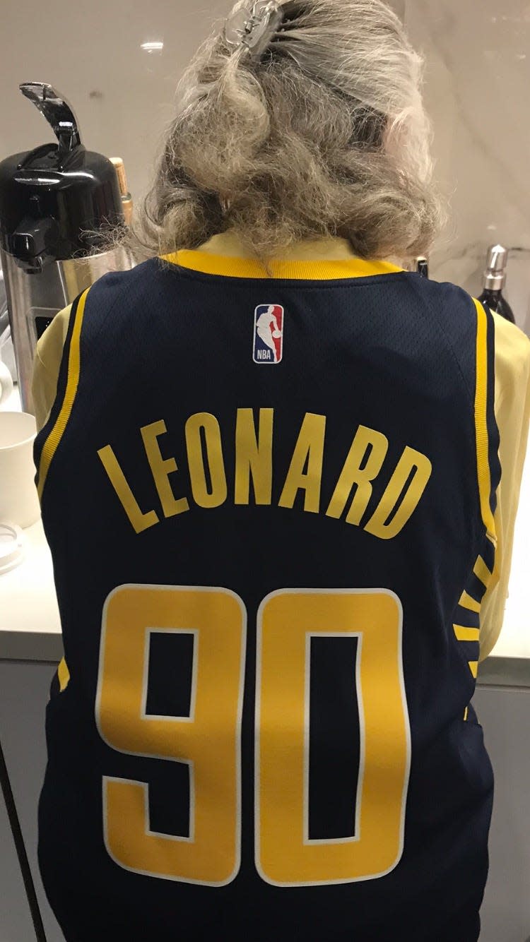 Nancy Leonard sits in an Indiana Pacers jersey featuring No. 90, in honor of her 90th birthday.