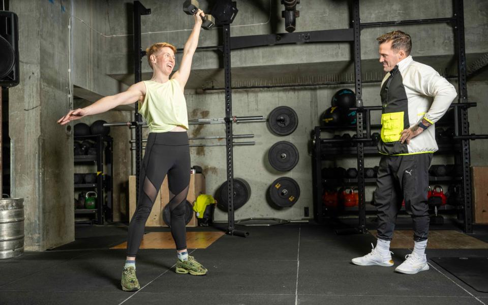 Fox-Leonard demonstrates a dumbell snatch