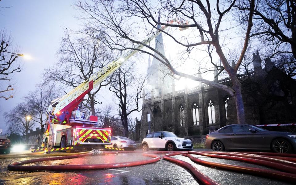 27 January 2023: Firefighters use hoses to dampen down at the scene of a fire at St Mark’s Church in Hamilton Terrace, St John’s Wood, London, which has been destroyed by the blaze which began in the early hours of the morning (PA)