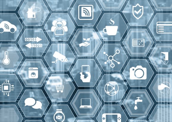 Different components of the Internet of Things, represented by a cluster of transparent hexagonal icons.