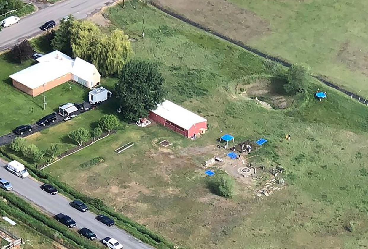 In this aerial photo provided by East Idaho News shows authorities investigating a home in Salem, Idaho, on Tuesday June 9, 2020.