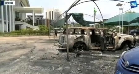 A still image from video of a fire damaged vehicle outside the national assembly building in Libreville, Gabon, September 2, 2016. GABON 24 TV/Handout via Reuters