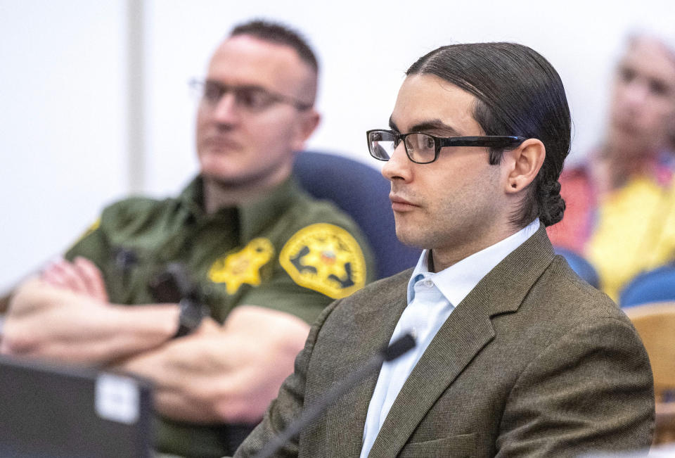 Marcus Eriz, right, sits in court during his sentencing, Friday, April 12, 2024, in Santa Ana, Calif. Eriz was sentenced Friday to 40 years to life for the fatal shooting of a 6-year-old boy who was riding in the back of his mother's car on the freeway, prosecutors said. (Mark Rightmire/The Orange County Register via AP)