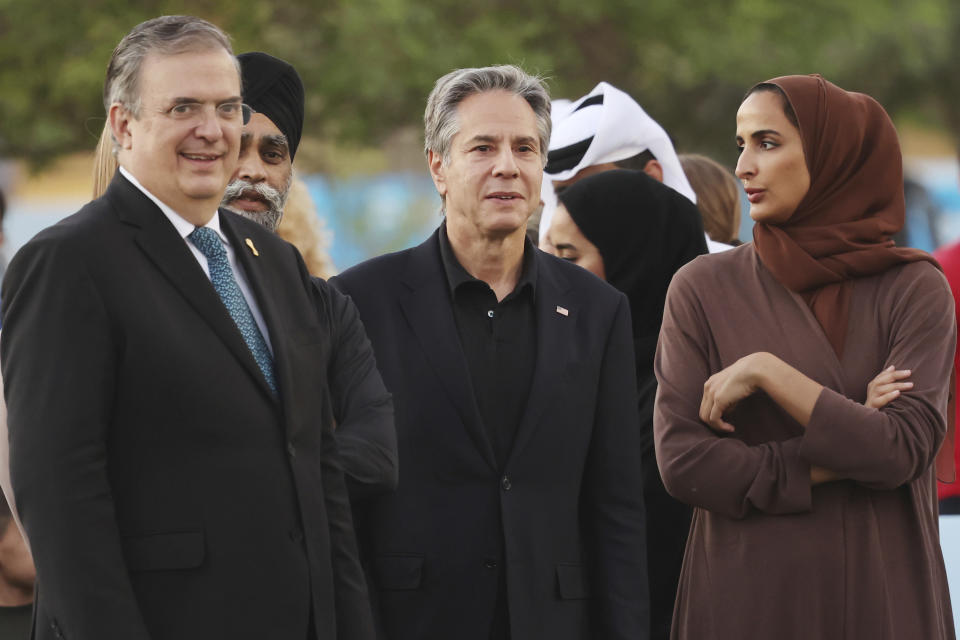 U.S. Secretary of State Anthony Blinken, center, speaks with Mexico's Foreign Affairs Secretary Marcelo Ebrard, left, and Qatar Foundation CEO Sheikha Hind Bint Al Thani during a visit to Oxygen Park at Education City, in Doha Qatar, Monday, Nov. 21, 2022. (Karim Jaafar/Pool via AP)