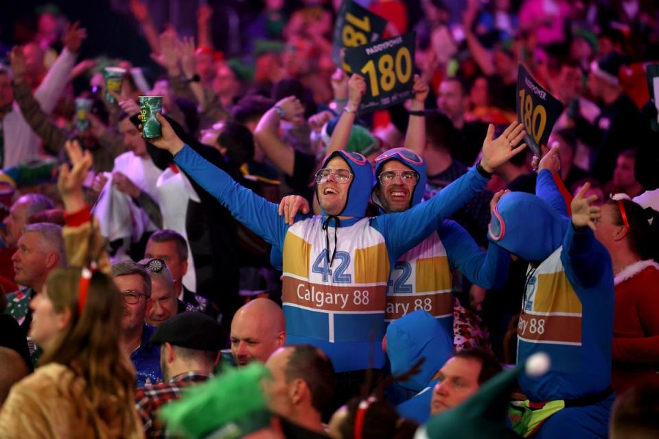 Having a brew-ski: fancy dress is encouraged and celebrated at the darts (Getty)