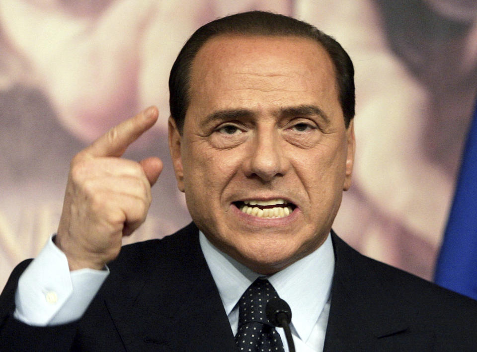 FILE - Italian Premier Silvio Berlusconi gestures as he delivers his speech during a press conference in Rome's Chigi palace Premier's office, Thursday, April 6, 2006. Berlusconi, the boastful billionaire media mogul who was Italy's longest-serving premier despite scandals over his sex-fueled parties and allegations of corruption, died, according to Italian media. He was 86. (AP Photo/Gregorio Borgia, File)