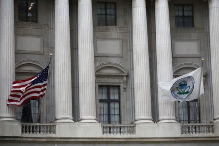 Flags fly outside the U.S. Environmental Protection Agency (EPA) at EPA headquarters in Washington, U.S., July 11, 2018. REUTERS/Ting Shen