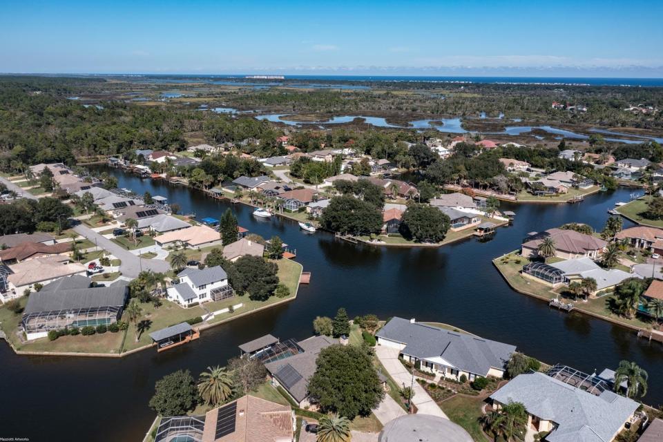 Intersecting waterways deliver million-dollar views for custom-built Don Lowe home in Palm Coast.