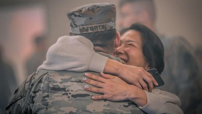 U.S. Army Air Defenders with Bravo Battery, 5th Battalion, 7th Air Defense Artillery Regiment, 10th Army Air Missile Defense Command, reunite with family and friends after a deployment to one year - PFC.  Yesenia Cadavid/US Department of Defense