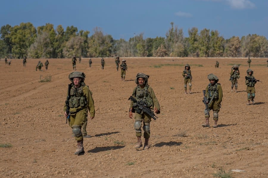 Israeli soldiers patrol next to communities near the Israeli-Gaza border, southern Israel, Friday, Oct. 20, 2023. (AP Photo/Ohad Zwigenberg)