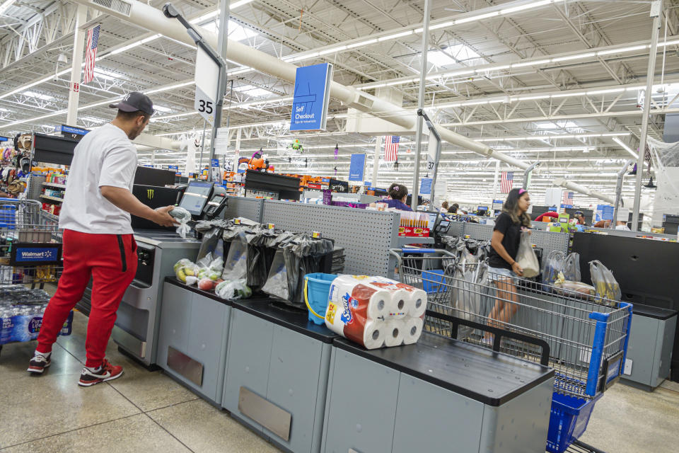 Miami, Hialeah Gardens, Florida, Walmart Supercenter, Self service checkout customer scanning and paying. (Photo by: Jeffrey Greenberg/Universal Images Group via Getty Images)