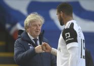 Crystal Palace manager Roy Hodgson with Fulham's Ruben Loftus-Cheek after the English Premier League soccer match between Crystal Palace and Fulham at Selhurst Park stadium in London, England Sunday, Feb.28, 2021. (Mike Hewitt/Pool via AP)