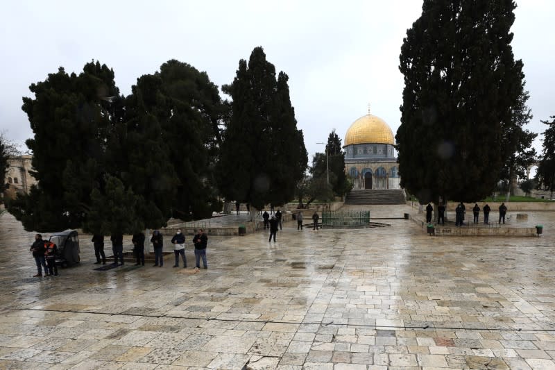 Muslim worshippers pray in small groups in front of the Dome of the Rock in the compound known to Muslims as Noble Sanctuary and to Jews as Temple Mount, in Jerusalem's Old City