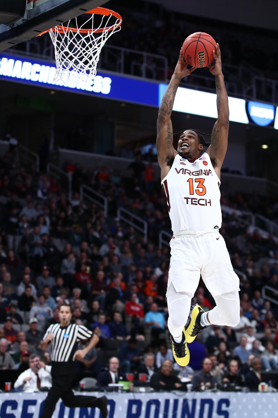 <p>Ahmed Hill #13 of the Virginia Tech Hokies dunks the ball against the Saint Louis Billikens during their game in the First Round of the NCAA Basketball Tournament at SAP Center on March 22, 2019 in San Jose, California. (Photo by Ezra Shaw/Getty Images) </p>