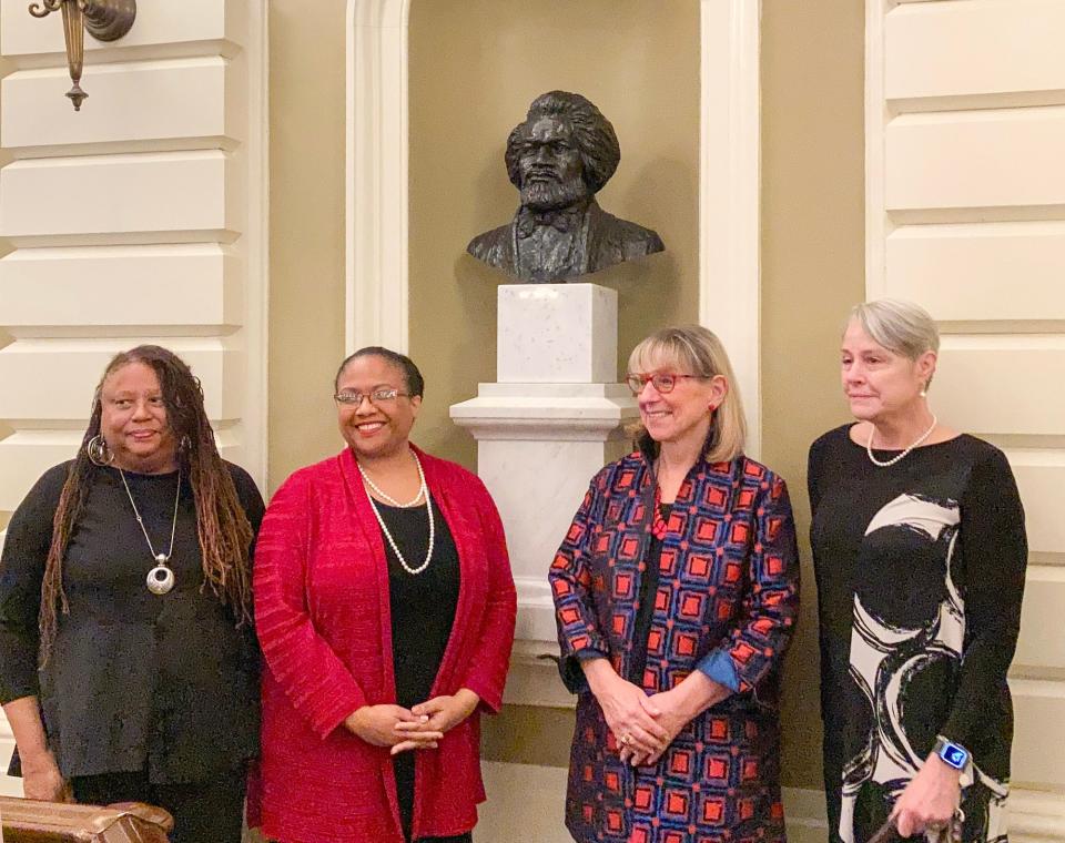 From left, L'Merchie Frazier, a member of the Statehouse Art Commission; Noelle Trent, president and CEO of the Museum of African American History; state Senate President Karen E. Spilka; and Nina Lillie LeDoyt, daughter of artist Lloyd Lillie, are photographed with the new bust of Frederick Douglass in the Massachusetts Statehouse on Wednesday.