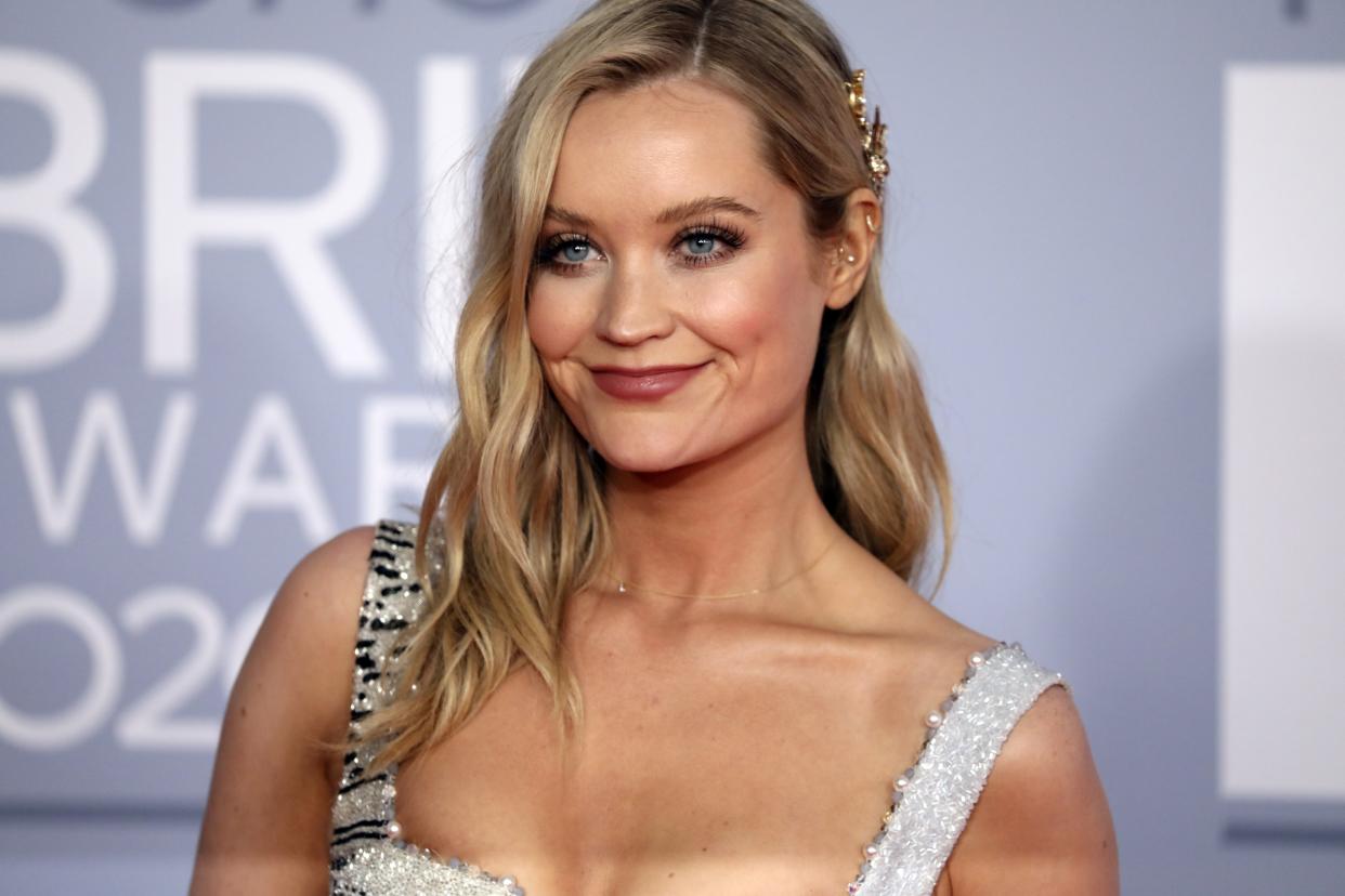 Laura Whitmore poses for photographers upon arrival at Brit Awards 2020 in London, Tuesday, Feb. 18, 2020.(Photo by Vianney Le Caer/Invision/AP)