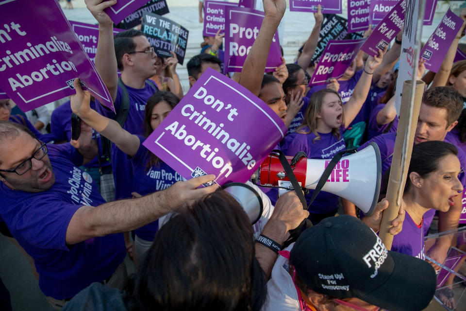 <p>Pro-choice and anti-abortion protesters demonstrate in front of the U.S. Supreme Court on July 9, 2018 in Washington, D.C. President Donald Trump is set to announce his Supreme Court pick Monday night. (Photo: Tasos Katopodis/Getty Images) </p>