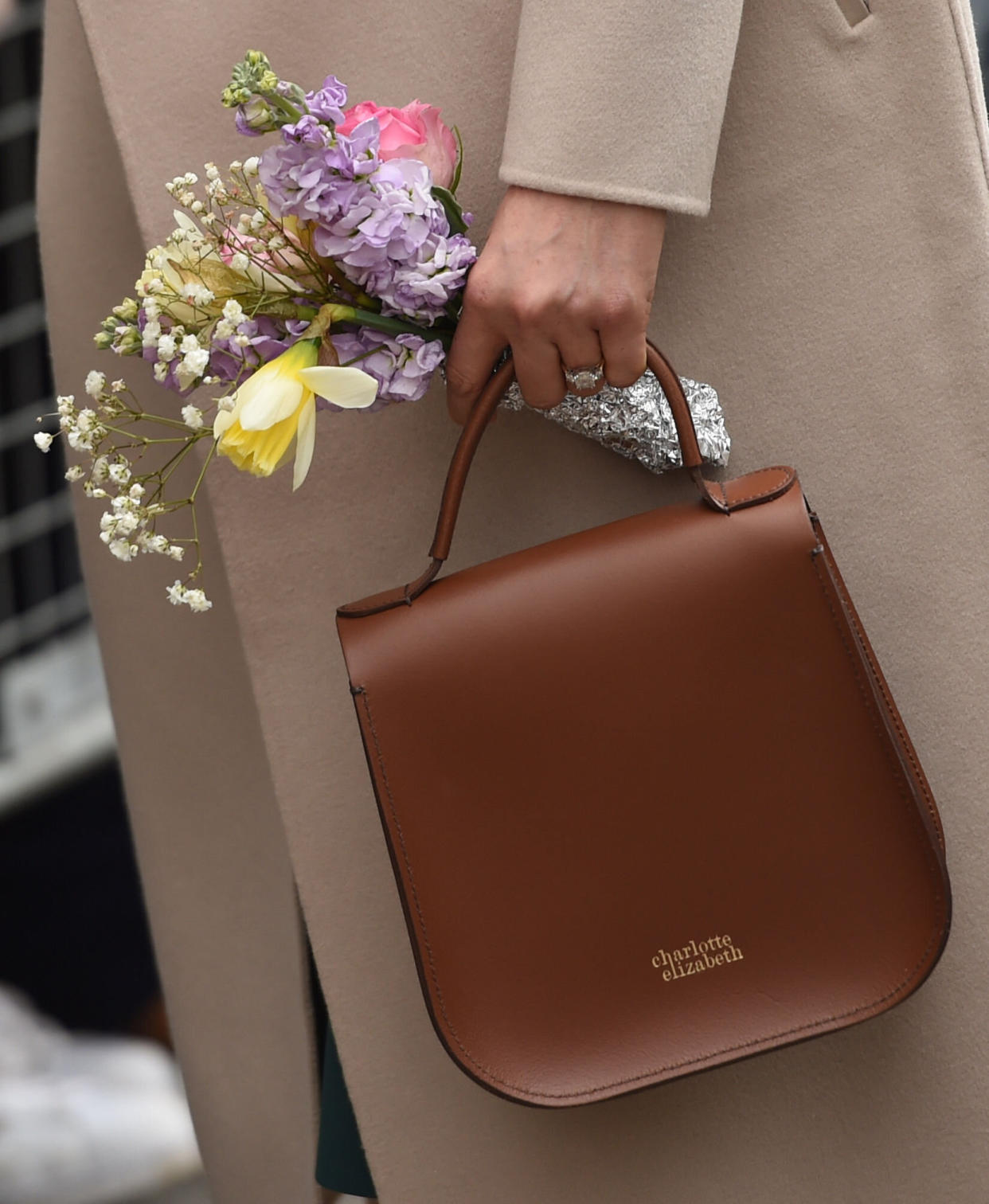 Meghan carries the Charlotte Elizabeth 'Bloomsbury' bag in Northern Ireland in March 2018 [Photo: PA]