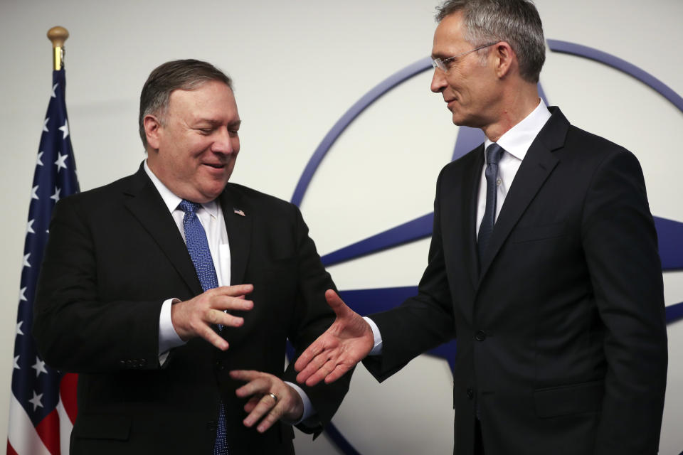 U.S. Secretary of State Mike Pompeo, left, shakes hands with NATO Secretary General Jens Stoltenberg prior to a meeting at NATO headquarters in Brussels, Tuesday, Dec. 4, 2018. U.S. Secretary of State Mike Pompeo on Tuesday took aim at China, Iran, Russia and others for violating numerous treaties and multi-state agreements and questioned whether many pillars of international trade and diplomacy are still relevant. (AP Photo/Francisco Seco, Pool)