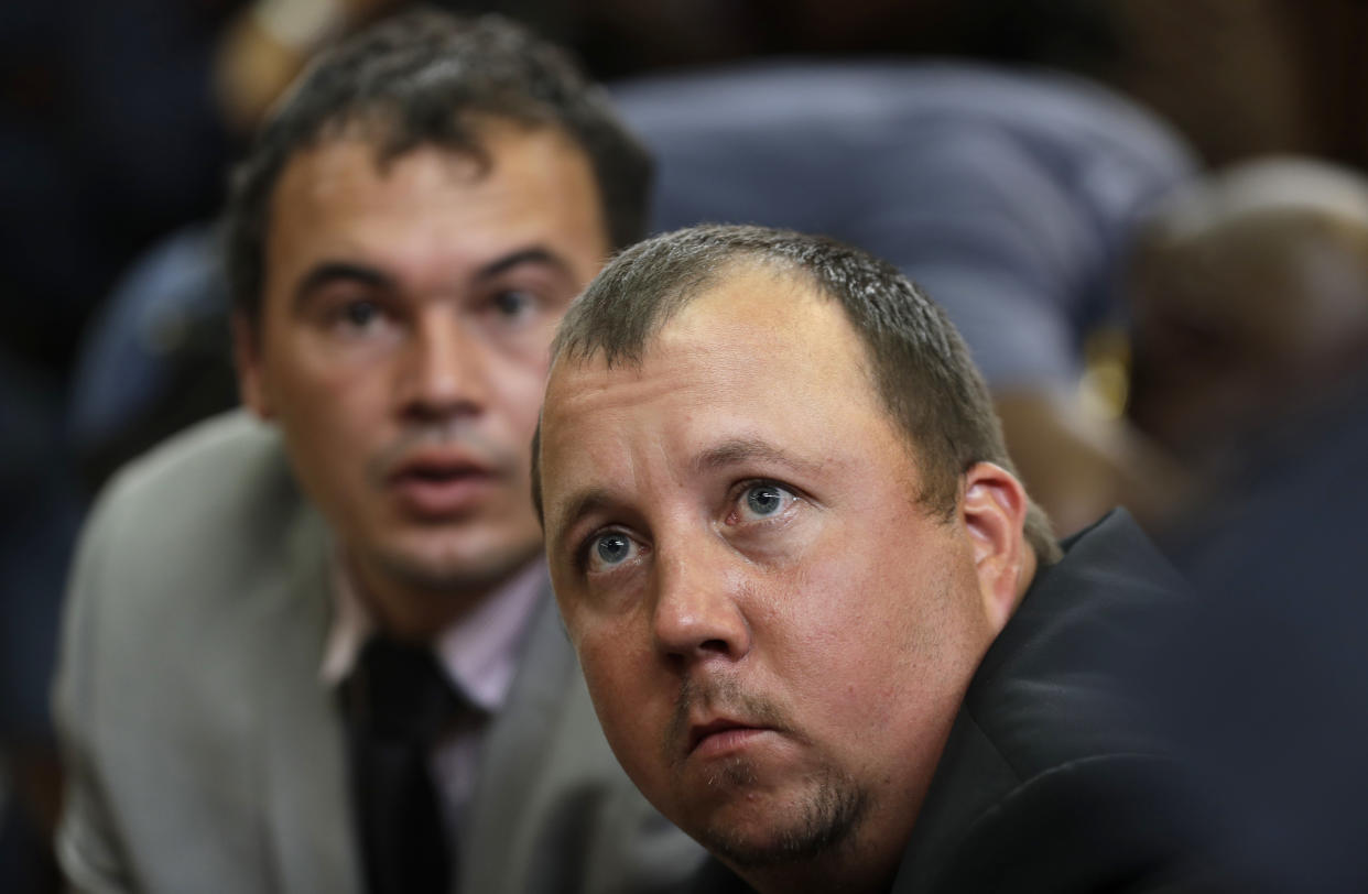 Theo Jackson, front, and Willem Oosthuizen, have been jailed for more than a decade each (AP)