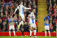 Atalanta's Gianluca Scamacca, right, celebrates scoring his side's 2nd goal during the Europa League quarter final first leg soccer match between Liverpool and Atalanta, at the Anfield stadium in Liverpool, England, Thursday, April 11, 2024. (AP Photo/Jon Super)