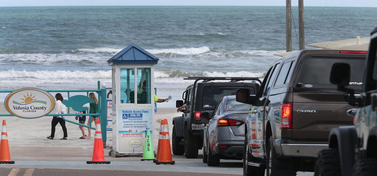 Cars wait to get on the beach at the International Speedway Boulevard beach ramp, Tuesday, Jan. 24, 2023.