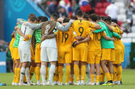 <p>Australia come together minutes after their first game ended in defeat </p>