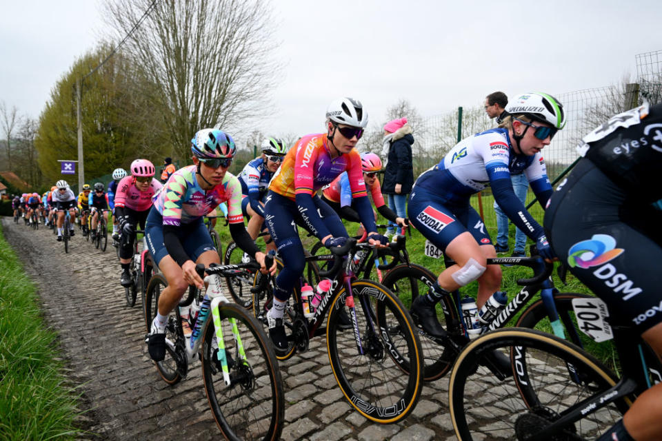 OUDENAARDE BELGIUM  APRIL 02 LR Katarzyna Niewiadoma of Poland and Team CanyonSRAM Racing Lotte Kopecky of Belgium and Team SD Worx and Maud Rijnbeek of The Netherlands and AG InsuranceSoudal QuickStep Team compete passing through a cobblestones sector during the 20th Ronde van Vlaanderen  Tour des Flandres 2023 Womens Elite a 1566km one day race from Oudenaarde to Oudenaarde  UCIWWT  on April 02 2023 in Oudenaarde Belgium Photo by Luc ClaessenGetty Images