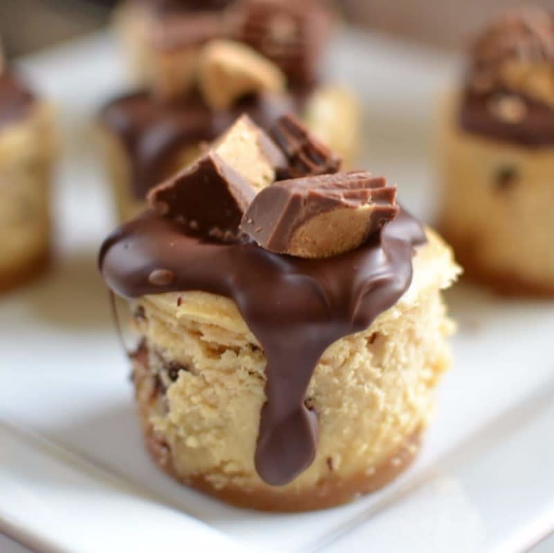 <p>Small Town Woman</p><p>These mini peanut butter cheesecakes are topped with a drop of delicious Ghirardelli chocolate and Reese’s mini peanut butter cups.</p><p><strong>Get the recipe: <a href="https://www.smalltownwoman.com/mini-peanut-butter-cheesecakes/" rel="nofollow noopener" target="_blank" data-ylk="slk:Mini Peanut Butter Cheesecakes;elm:context_link;itc:0;sec:content-canvas" class="link rapid-noclick-resp">Mini Peanut Butter Cheesecakes</a></strong></p>