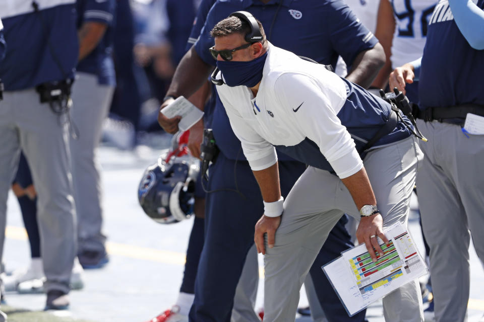 FILE - In this Sunday, Sept. 20, 2020, file photo, Tennessee Titans head coach Mike Vrabel watches from the sideline during the first half of an NFL football game against the Jacksonville Jaguars in Nashville, Tenn. Vrabel’s debut as an NFL head coach came in the league’s longest game because of lightning delays, and now he’s guiding the Tennessee Titans through the league’s first COVID-19 outbreak. (AP Photo/Wade Payne, File)