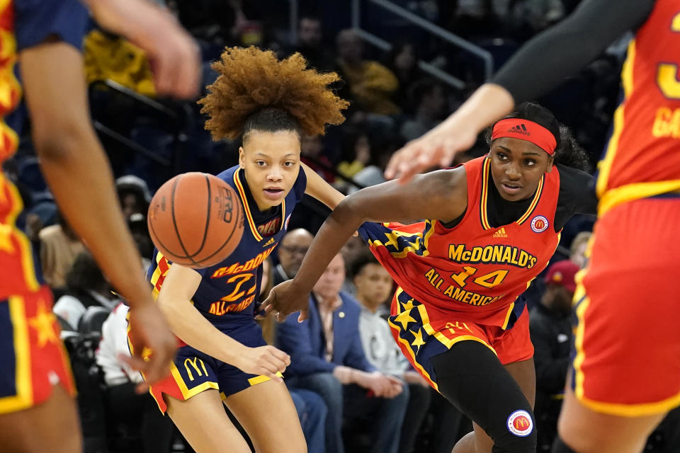 East girl's Paris Clark, left, and West girl's KK Bransford battle for a loose ball in the first half of the McDonald's All-American Girls basketball game Tuesday, March 29, 2022, in Chicago. (AP Photo/Charles Rex Arbogast)