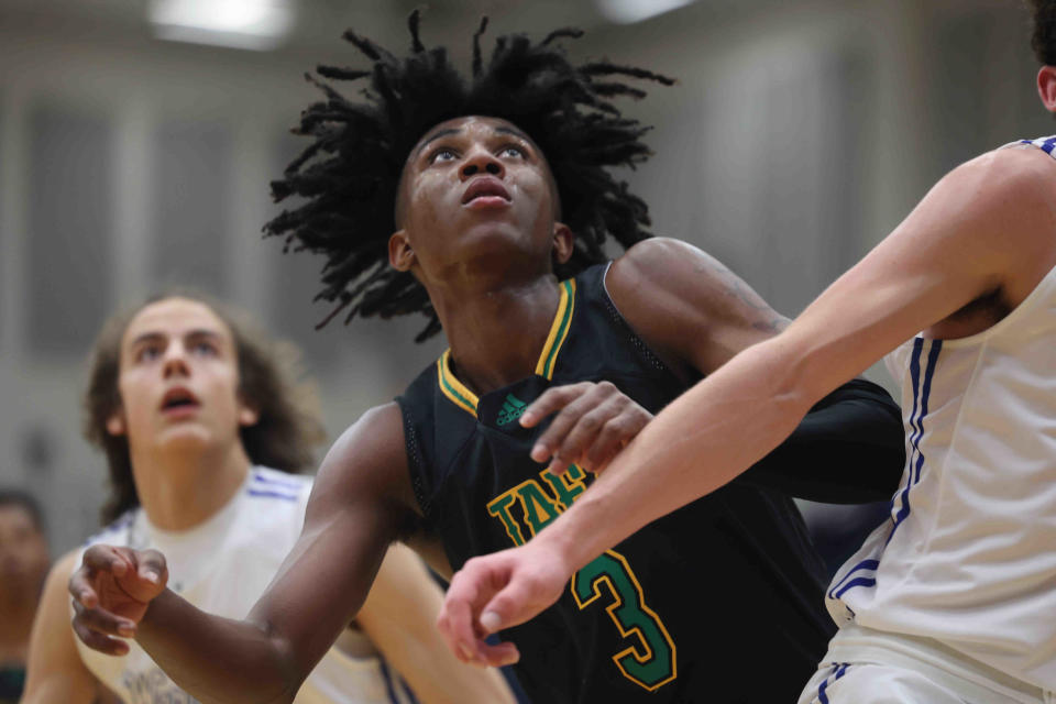 Taft's Rayvon Griffith (3) battles for rebound position during the regional tournament win over Mariemont, Wednesday, March 9, 2022.