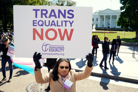 FILE PHOTO: Transgender rights activists protest the government's alleged attempt to strip transgender people of official recognition at the White House in Washington, U.S., October 22, 2018. REUTERS/Kevin Lamarque/File Photo