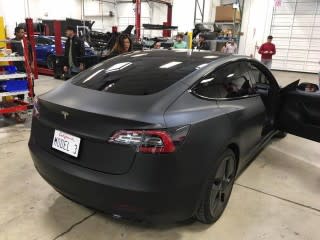 Tesla Model 3 spotted at service center