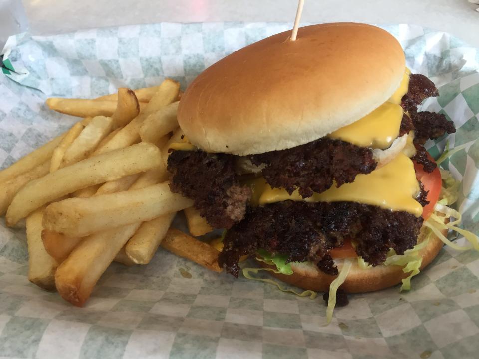 A double cheeseburger with fries from Workingman's Friend