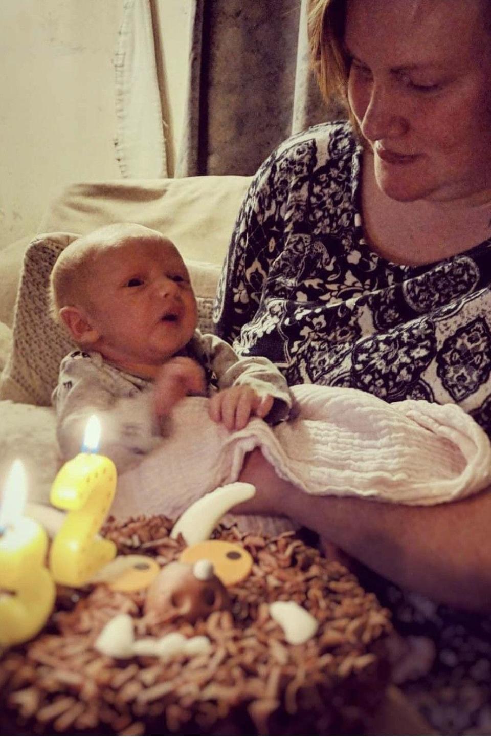 Woman holds newborn baby