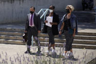 Lawyer Javier Villalba, left and John McAfee's wife Janice, centre, enter the Brians 2 penitentiary center with an unidentified woman in Sant Esteve Sesrovires, near Barcelona, northeast Spain, Friday, June 25, 2021. A judge in northeastern Spain has ordered an autopsy for John McAfee, creator of the McAfee antivirus software, a gun-loving antivirus pioneer, cryptocurrency promoter and occasional politician who died in a cell pending extradition to the United States for allegedly evading millions in unpaid taxes. McAfee's Spanish lawyer, Javier Villalba, said the entrepreneur's death had come as a surprise to his wife and other relatives, since McAfee "had not said goodbye." (AP Photo/Joan Mateu)