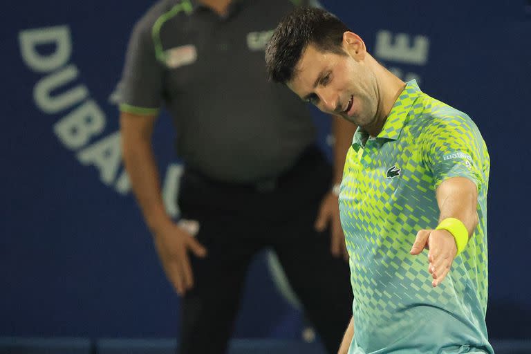 Serbia's Novak Djokovic reacts during his match with Russia's Daniil Medvedev (not pictured) at the ATP Dubai Duty Free Tennis Championship semi-final match in Dubai, on March 3, 2023. (Photo by Karim SAHIB / AFP)