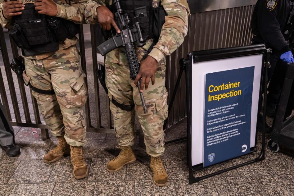 National Guard troops at bag search checkpoints in the NYC subway will no longer carry heavy assault weapons. Getty Images