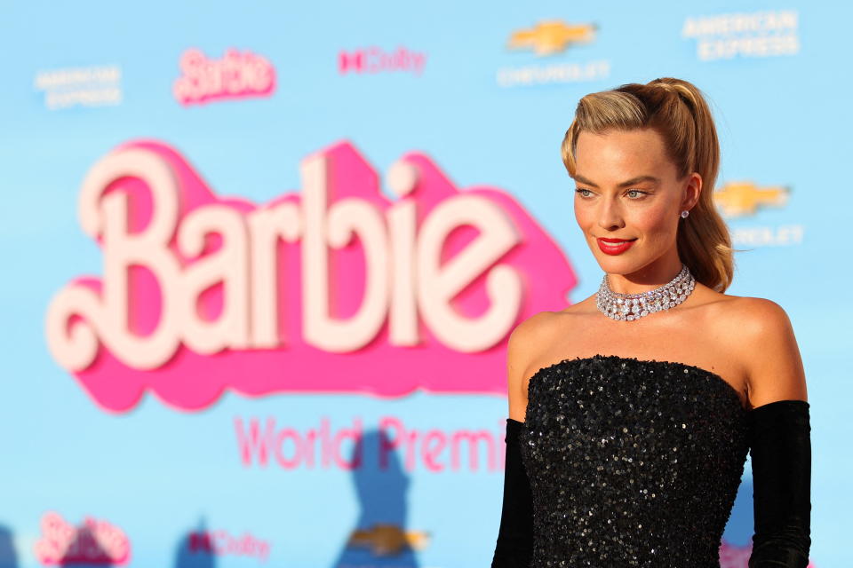 Margot Robbie poses on the pink carpet at the film's world premiere 