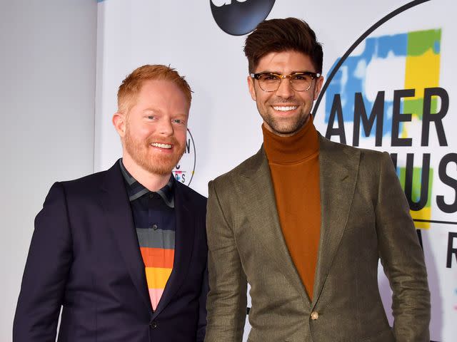 Jeff Kravitz/AMA2017/FilmMagic Jesse Tyler Ferguson and his husband Justin Mikita at the 2017 American Music Awards on Nov. 19, 2017 in Los Angeles, California