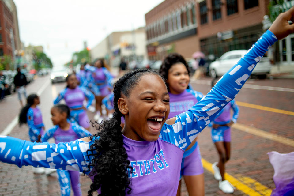 Lexi Watson, 10, of Flint, smiles as she shouts out with joy in downtown Flint, Michigan. (Jake May / MLive.com / AP)