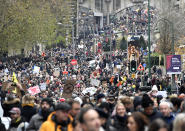 Demonstrators march during a protest against coronavirus measures in Brussels, Belgium, Sunday, Dec. 5, 2021. Hundreds of people marched through central Brussels on Sunday to protest tightened COVID-19 restrictions imposed by the Belgian government to counter the latest spike in coronavirus cases. (AP Photo/Geert Vanden Wijngaert)