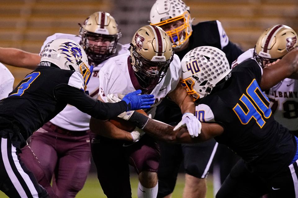 Gahanna's Isaiah Wills-Jackson (3) and Kamari Burns (40) tackle New Albany's Christian Manville (32) during the Division I, Region 3 final Nov. 18 at Historic Crew Stadium. Burns and Manville have been selected for the Divisions I-III North-South all-star football game.