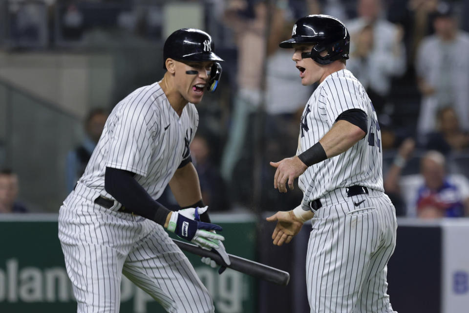 New York Yankees' Harrison Bader celebrates Aaron Judge after scoring against the Pittsburgh Pirates during the fifth inning of a baseball game Tuesday, Sept. 20, 2022, in New York. (AP Photo/Jessie Alcheh)