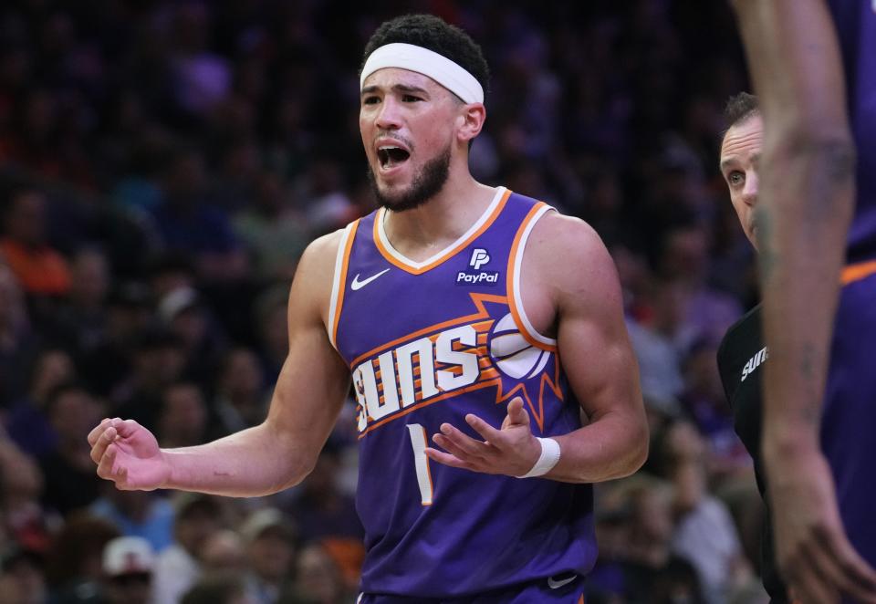 Phoenix Suns guard Devin Booker (1) reacts after turning the ball over against the New Orleans Pelicans at Footprint Center in Phoenix on April 7, 2024.