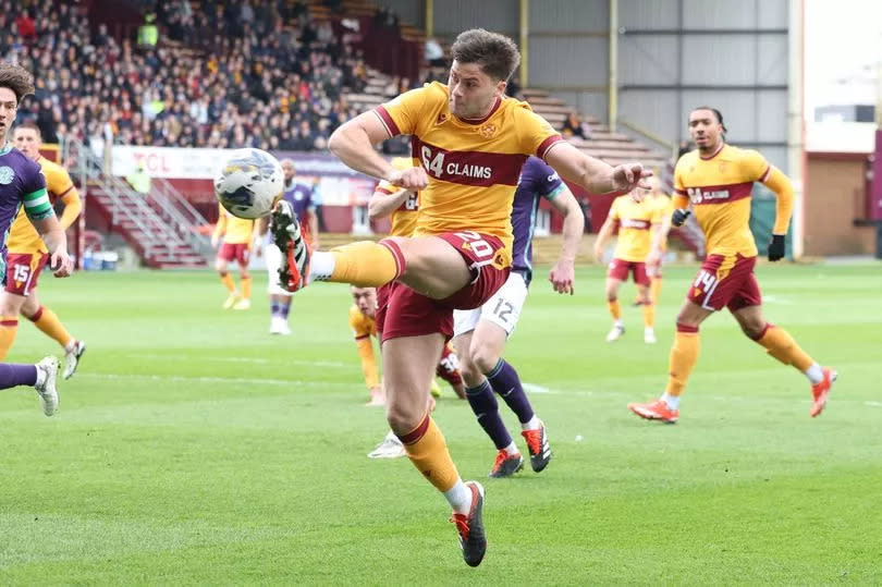 Shane Blaney blasts the ball forward during a crucial Premiership clash