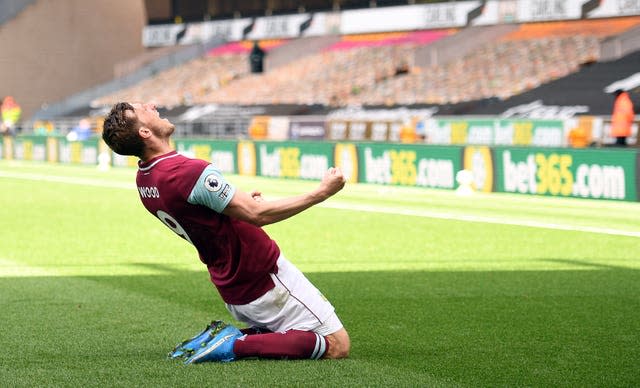 Chris Wood celebrates hit hat-trick goal against Wolves