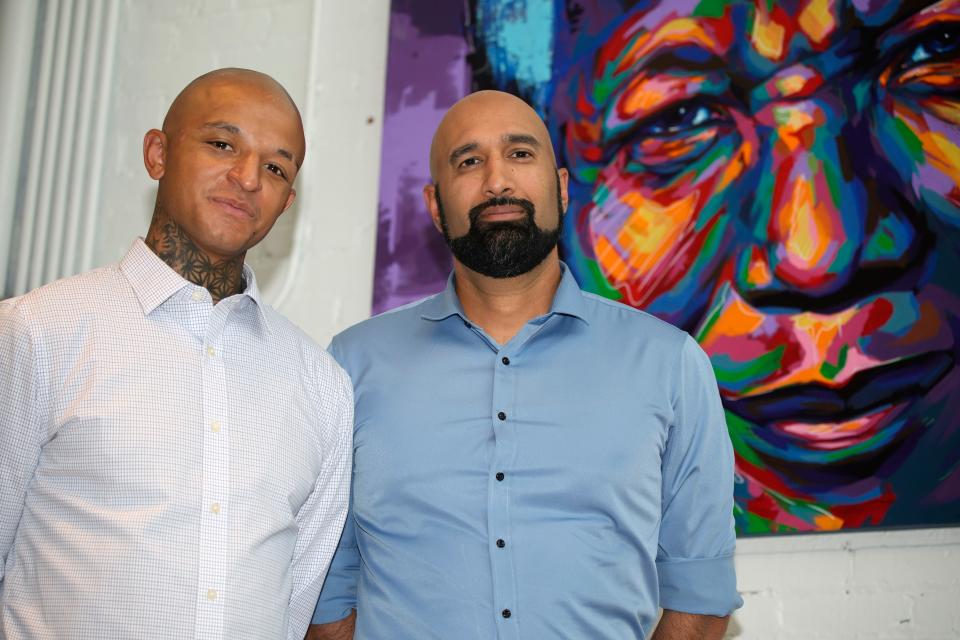 Kyle Vinson left, stands with his attorney, Qusair Mohamedbhai, on Wednesday, Aug. 4, 2021, in Denver. Aurora Officer John Haubert was arrested Monday on suspicion of attempted first-degree assault, second-degree assault, and felony menacing charges following a criminal investigation into the arrest last week of Vinson, who is biracial and identifies as Black.