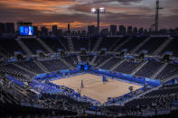 The sun sets during a break of beach volleyball at the 2020 Summer Olympics in Shiokaze Park, Tokyo, Japan on Monday, July 26, 2021.(AP Photo/Petros Giannakouris),